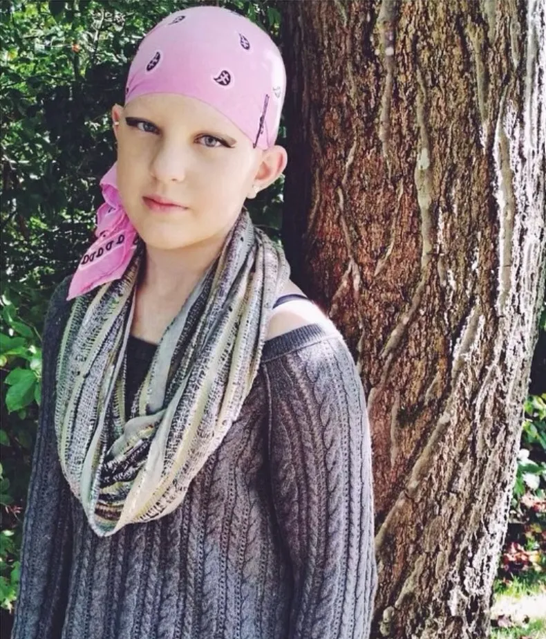 Emmy as a child wearing a bandana